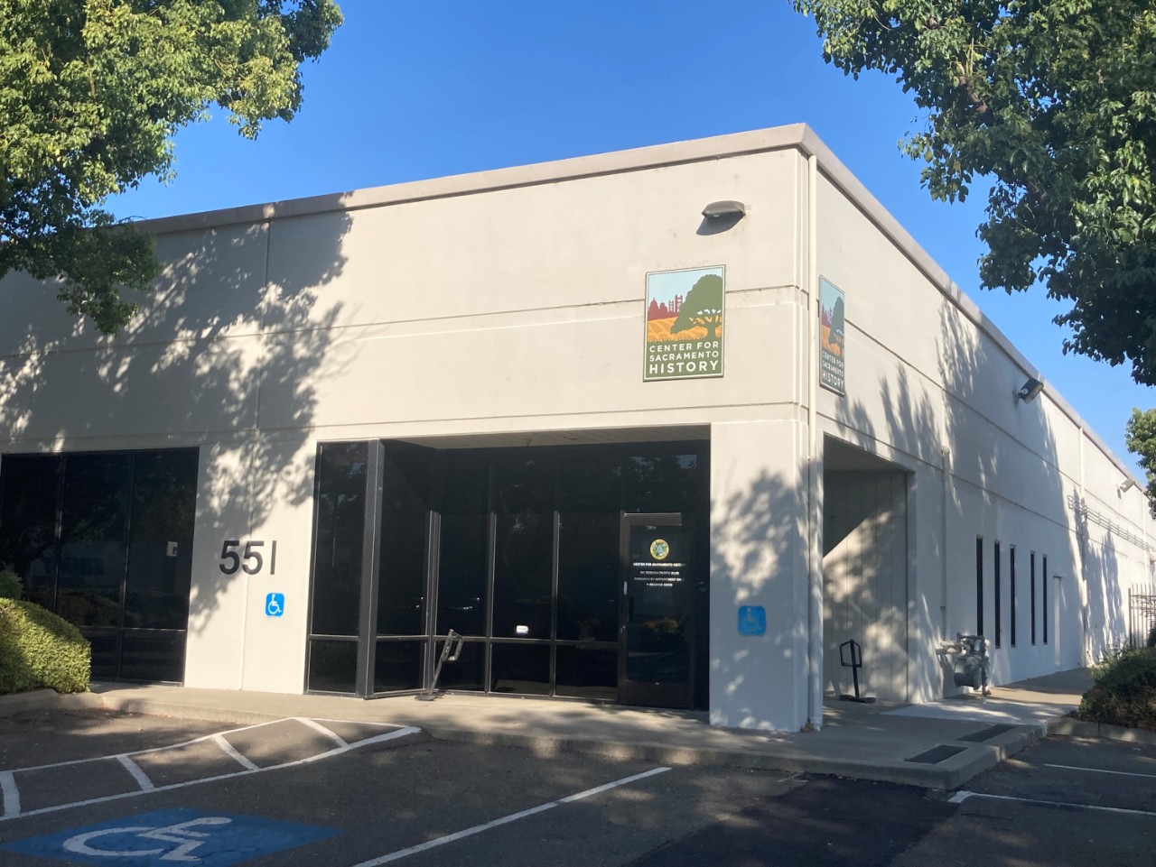 Exterior photo of the CSH building with logo hung above the door