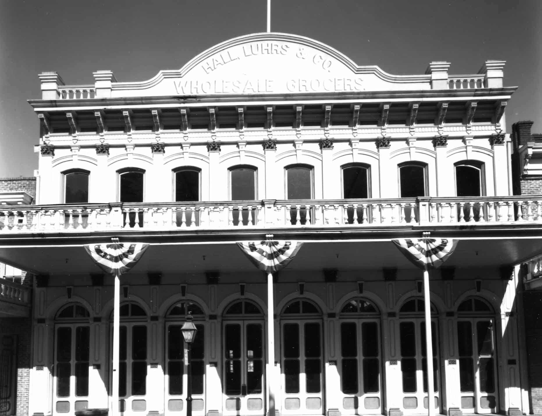 Black and white photo of the Hall, Luhrs & Co building in Old Sacramento