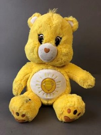 A stuffed yellow Funshine bear from the Care Bears