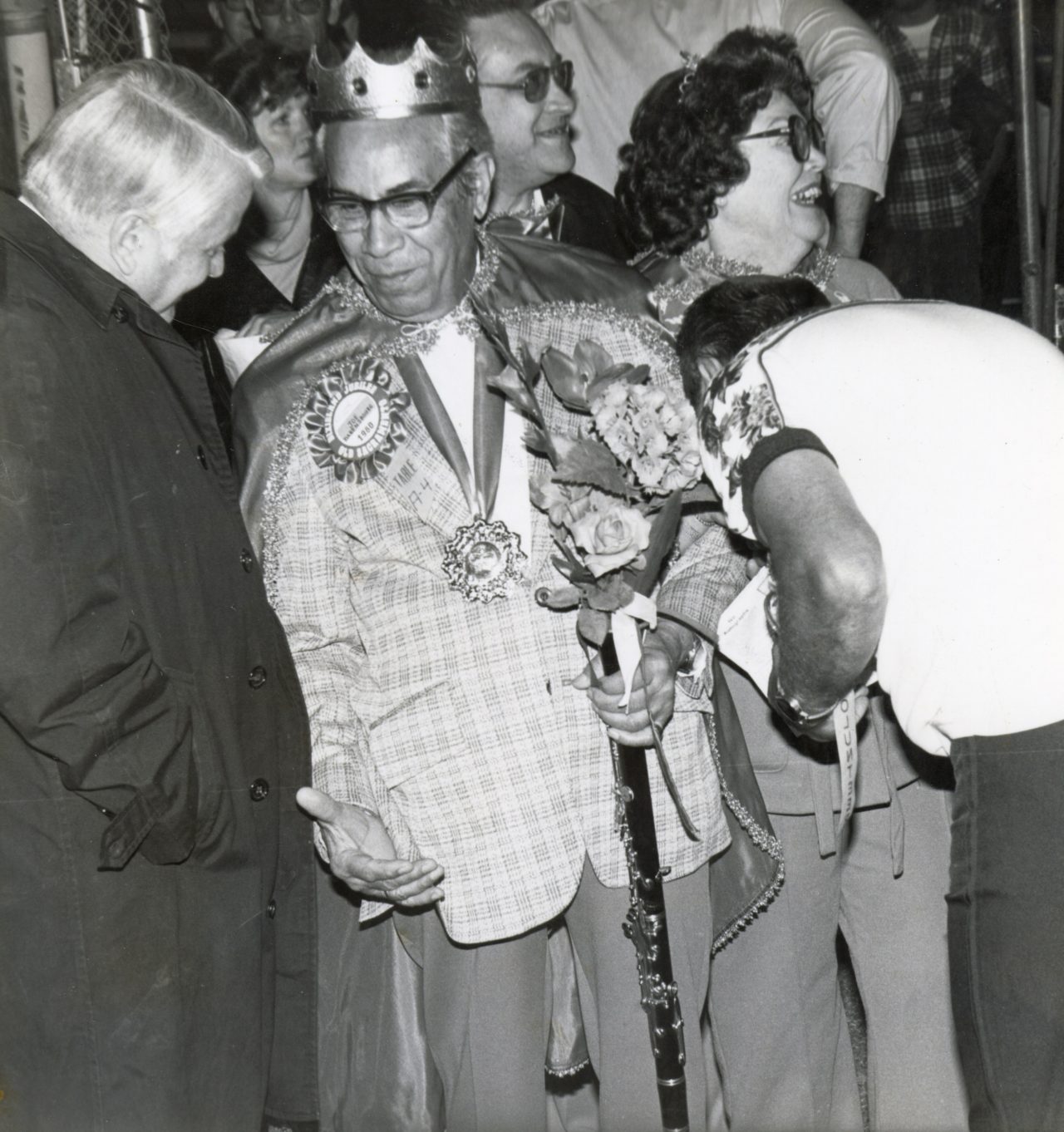 Joe Darensbourg as jubilee emperor with crown and clarinet scepter. 