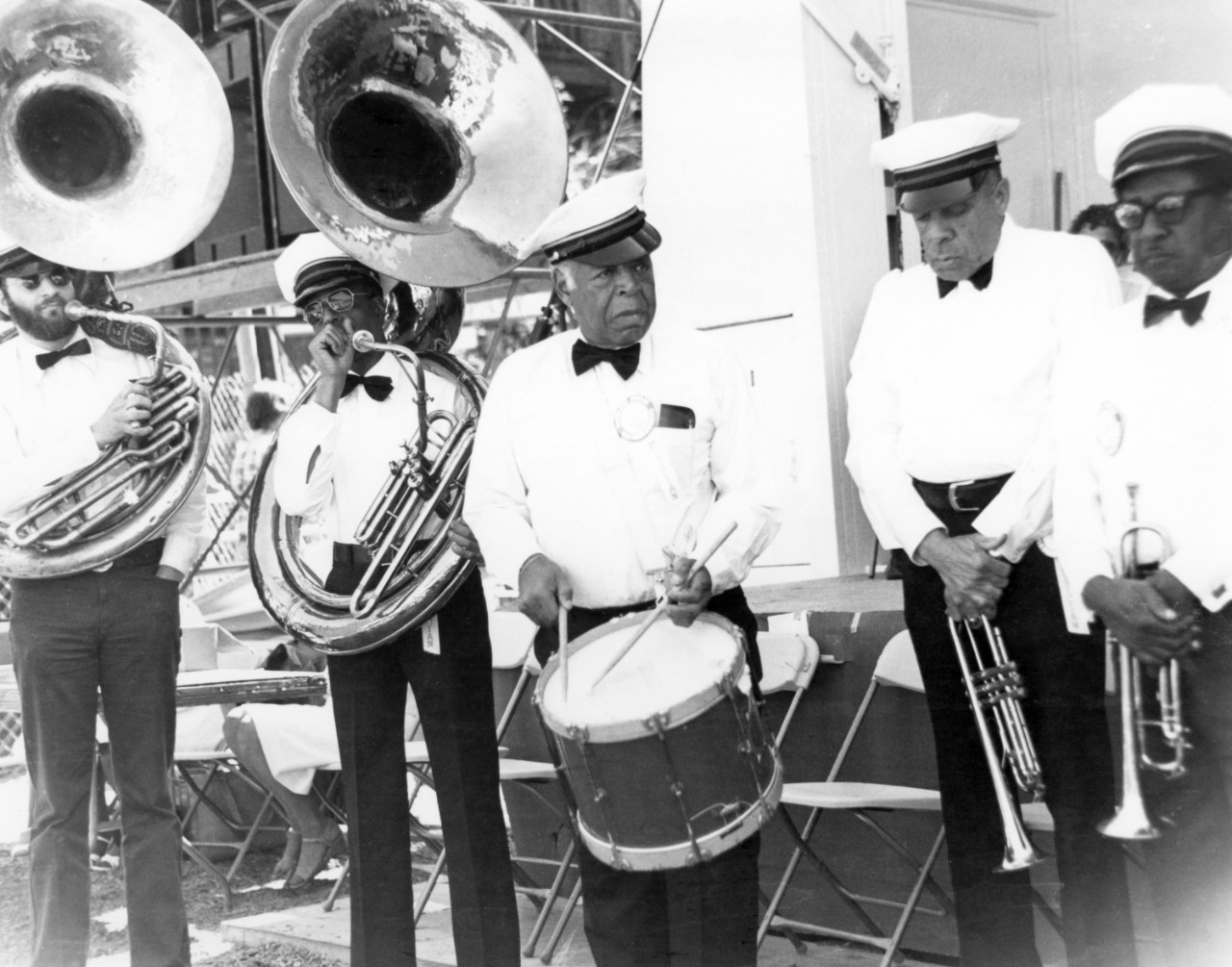A group of five musicians ready on stage.